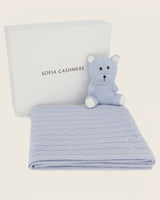 Cashmere Baby blanket with teddy bear in soft blue and Sofia Cashmere logo on a light background