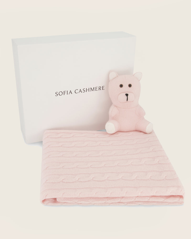 Cashmere teddy bear and blanket set in soft pink with 'Sofia Cashmere' branding on a light background