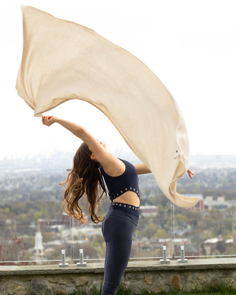 Woman wearing Voyage Cashmere Travel Wrap in oatmeal 