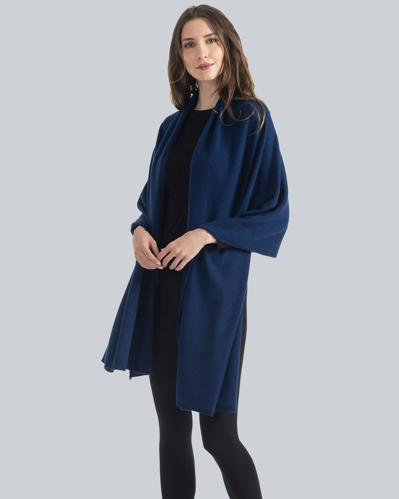 woman wearing Voyage Cashmere Travel Wrap in navy