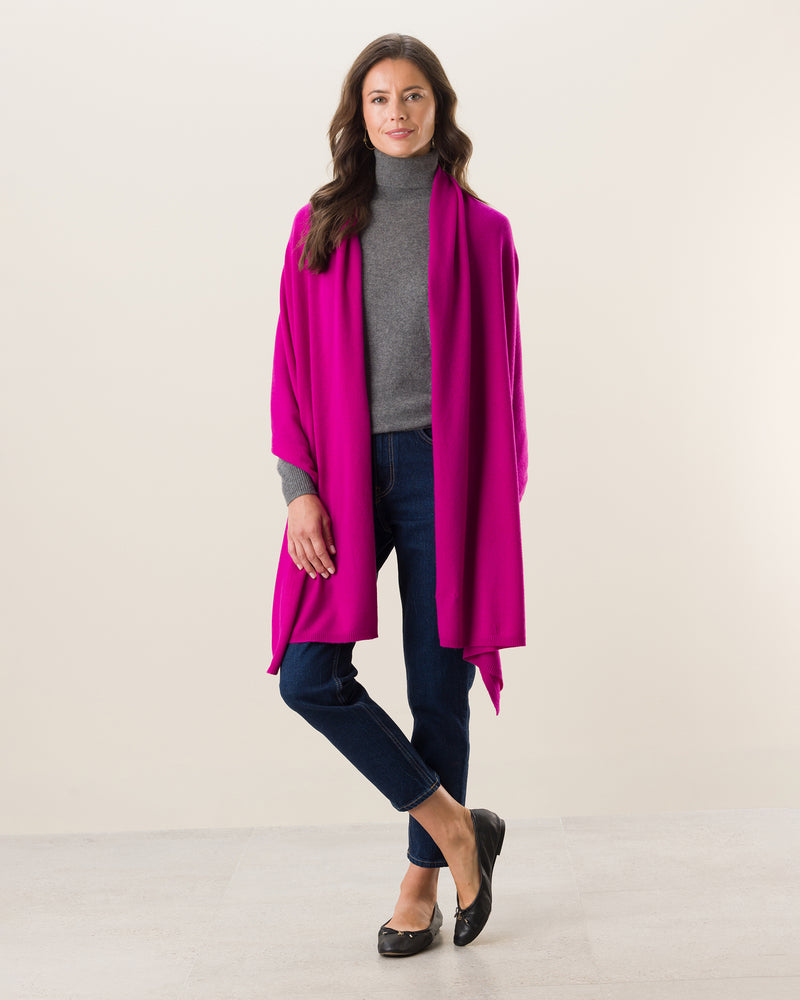 Woman wearing Voyage Cashmere Travel Wrap in Fuschia