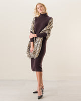 Woman wearing Lightweight cashmere wrap in white leopard