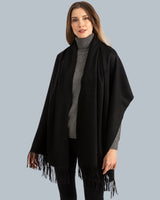 Woman wearing Cashmere water weave wrap with fringe in black