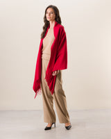 Woman wearing Cashmere water weave wrap with fringe in red