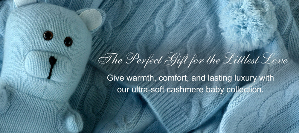 Blue teddy bear and cashmere blanket with promotional text on a blue background; the perfect gift for the littlest love, give warmth, comfort, and lastingluxury with our ultra-soft cashmere baby collection