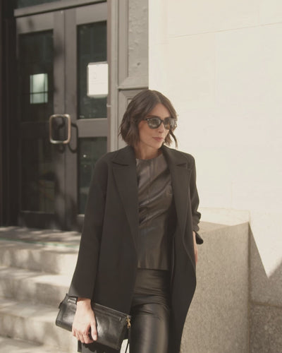 woman walking on city street wearing sofia cashmere branded cashmere car coat in Camel