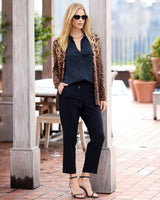 model on a rooftop wearing Savanna Open Animal Print Cardigan in camel multi