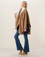 Woman Wearing Alpaca Wool Cape with Leather trim in camel