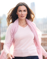model wearing a scarf and Pura Baby Cashmere V-Neck Sweater in petal pink
