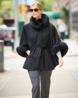 Frostmere Belted Cashmere Cape in black on model wearing sunglasses