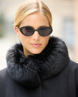 Close up of model wearing Frostmere Belted Cashmere Cape in black