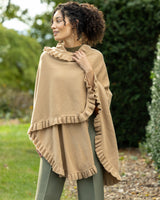 woman outside wearing volant ruffle cashmere cape in camel