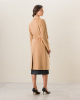 Back view of woman wearing Carmela Belted Wrap Cashmere coat in camel