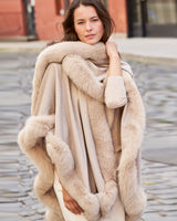 Woman wearing Fur Trimmed Cashmere cape in Blonde