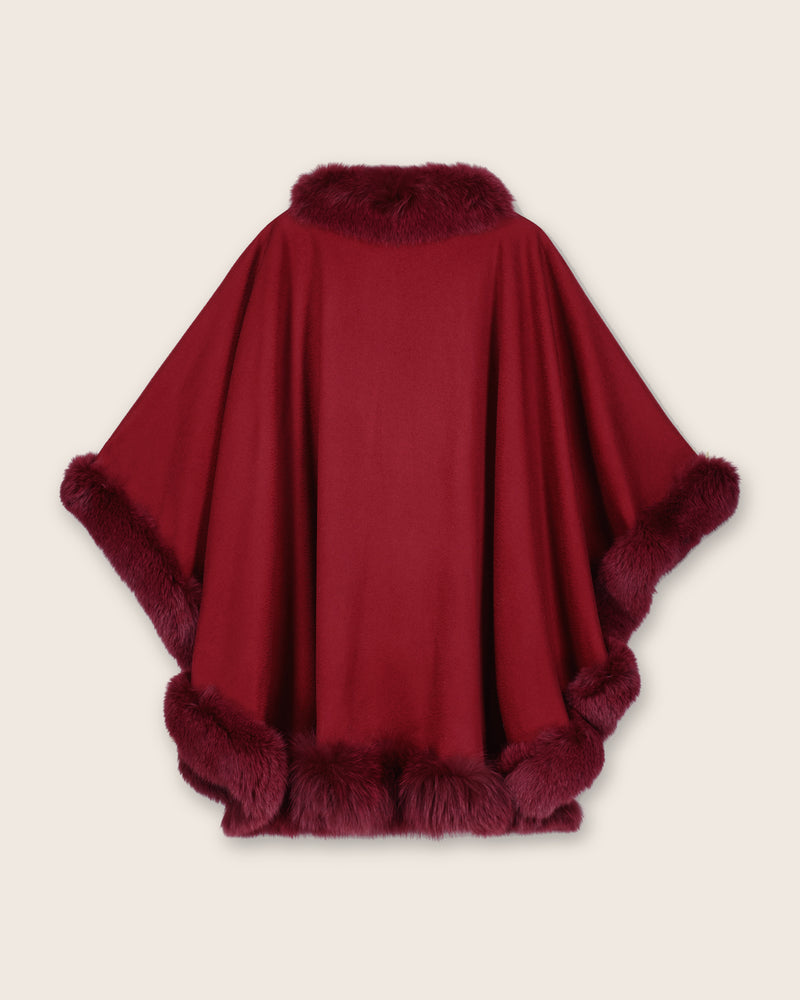 back view of burgundy cape with fur trim on a clean background