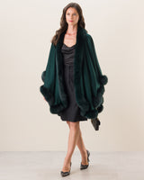 Woman Wearing Fur Trimmed cashmere Cape in Emerald