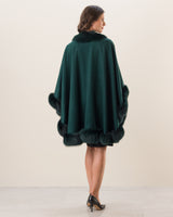 Woman Wearing Fur Trimmed cashmere Cape in Emerald