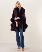 Woman Wearing Fur Trimmed cashmere Cape in plum