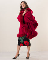 Woman wearing Fur Trimmed cashmere Cape in red