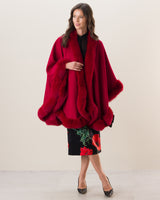 Woman wearing Fur Trimmed cashmere Cape in Red