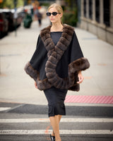 Model walking in the city wearing Imperial Sable Cashmere Cape  in black
