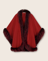 Brick Multi cape with fur trim on a beige background