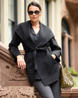 Éloise Double-Face Hooded Wrap Coat in black on model with bag and sunglasses