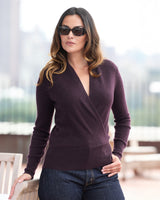 model wearing sunglasses and Élan Faux Wrap Cashmere Sweater in fig