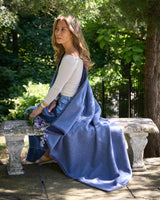 Gotham Whipstitch Dual-Colored Cashmere Throw in navy-denim on model outside