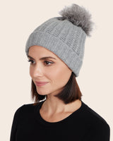 woman wearing grey pomerano cashmere hat with beanie