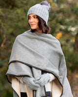 woman wearing poncho and Pomerano Cashmere PomPom hat in Grey