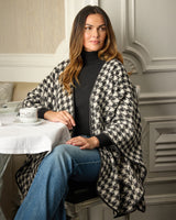 Renard Houndstooth Cape with Leather Trim on model sitting at a cafe