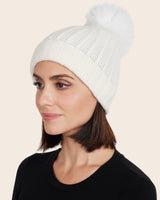 woman wearing cuffed cashmere hat with pompom in ivory