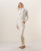 Woman wearing Wrap sweater with fur collar in Ivory