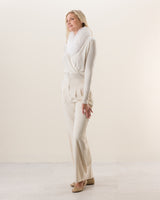 Woman wearing Wrap sweater with fur collar in Ivory