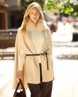 model wearing Arden Cashmere Cape in oat with a belt