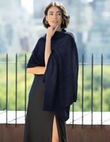 Woman wearing Radiant Sequin Wrap in Dark Navy on rooftop