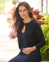 Sequin Bolero Cardigan in black on a model, up close
