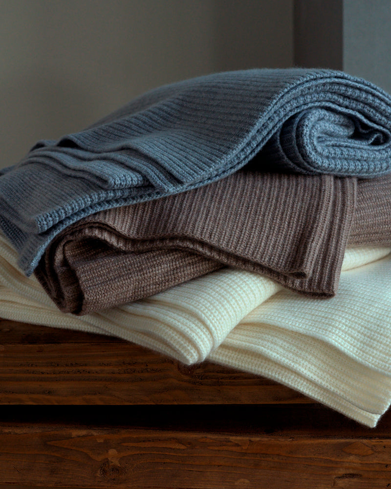 stack of cashmere Shaker knit throw in ivory