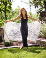 Woman holding Ecru lightweight wrap outdoors