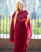 Woman wearing a formal dress with a Lightweight Cashmere Wrap in Bordeaux on a rooftop with cityscape background