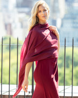 Woman wearing a dress with Lightweight Cashmere Wrap in Bordeaux