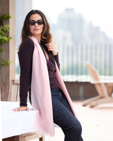 Model wearing St Tropez wrap in pink with a sweater, jeans and sunglasses