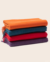 stack of trentino throws brights in purple