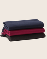 Stack of Trentino cashmere throws in classic colors
