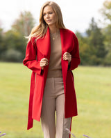 woman walking in a field and wearing Victoria cashmere blend Coat in Red