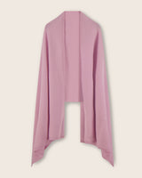 cashmere travel wrap scarf in light pink draped over a light background