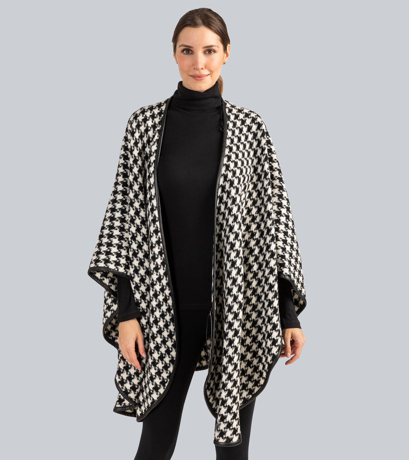 Woman Wearing Alpaca Wool Cape with Leather trim in Black and White Houndstooth Pattern.