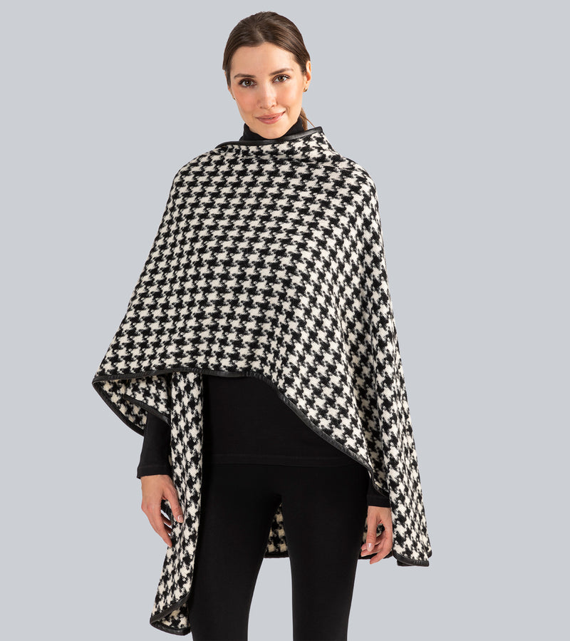 Woman Wearing Alpaca Wool Cape with Leather trim in Black and White Houndstooth Pattern.